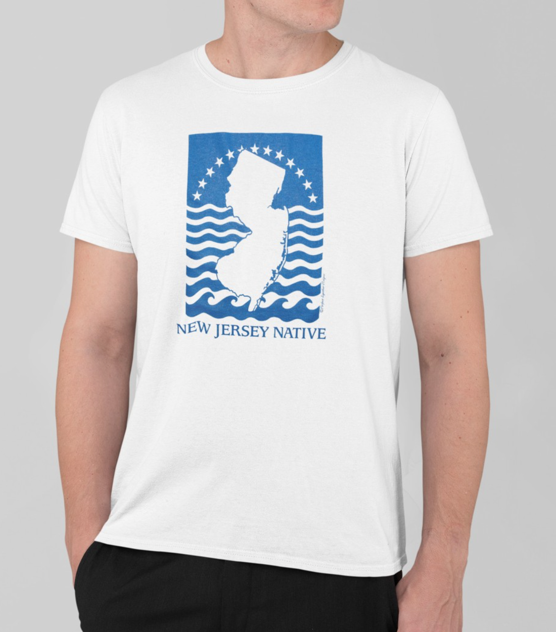 White t-shirt with blue and white graphic and text 'New Jersey Native' on a gray background
