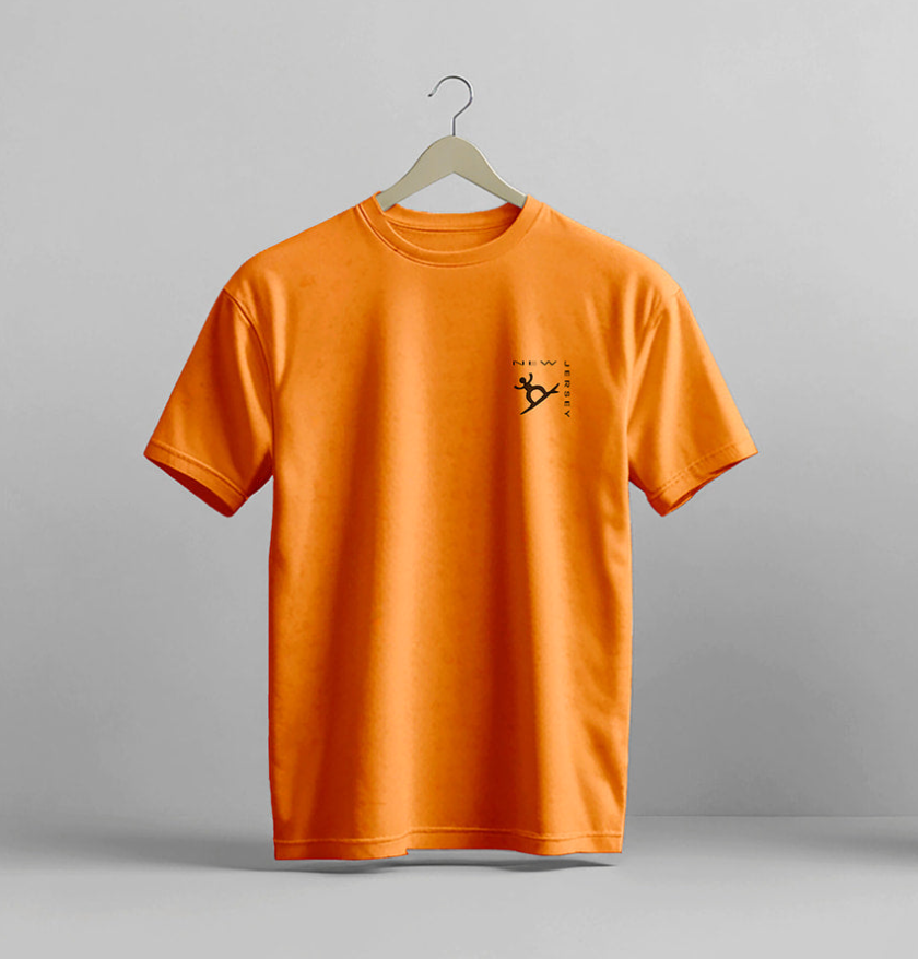 Orange t-shirt with a small logo on a gray background. T-shirt is on a hanger