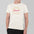 Person wearing a white t-shirt with 'New Jersey's Finest Export' text on a gray background