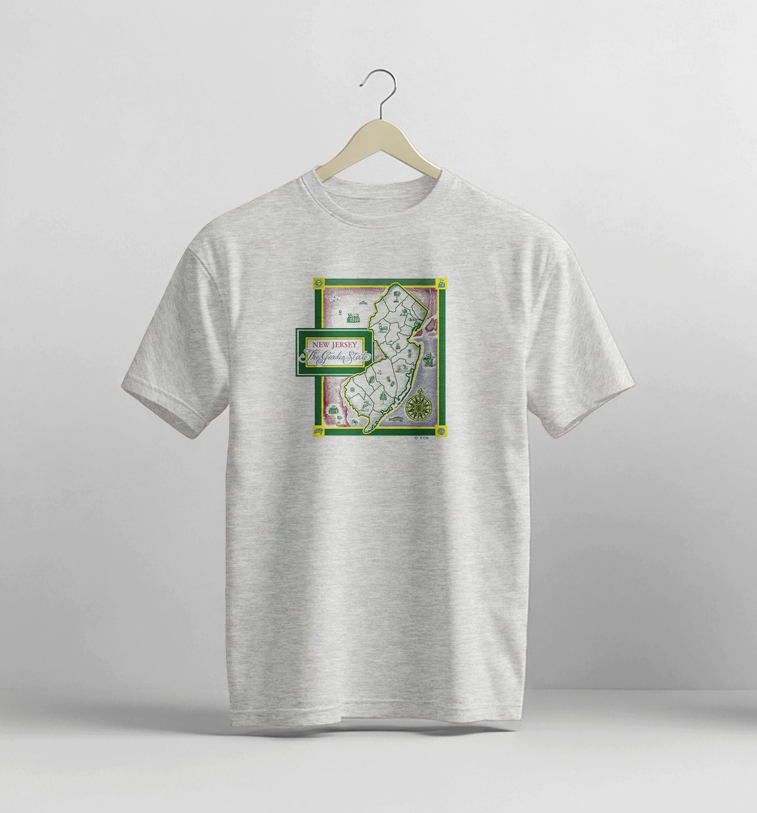 Gray t-shirt with a graphic design on a white background