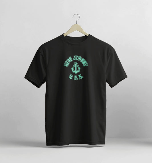 Black t-shirt with 'New Jersey USA' design on a hanger against a light gray background