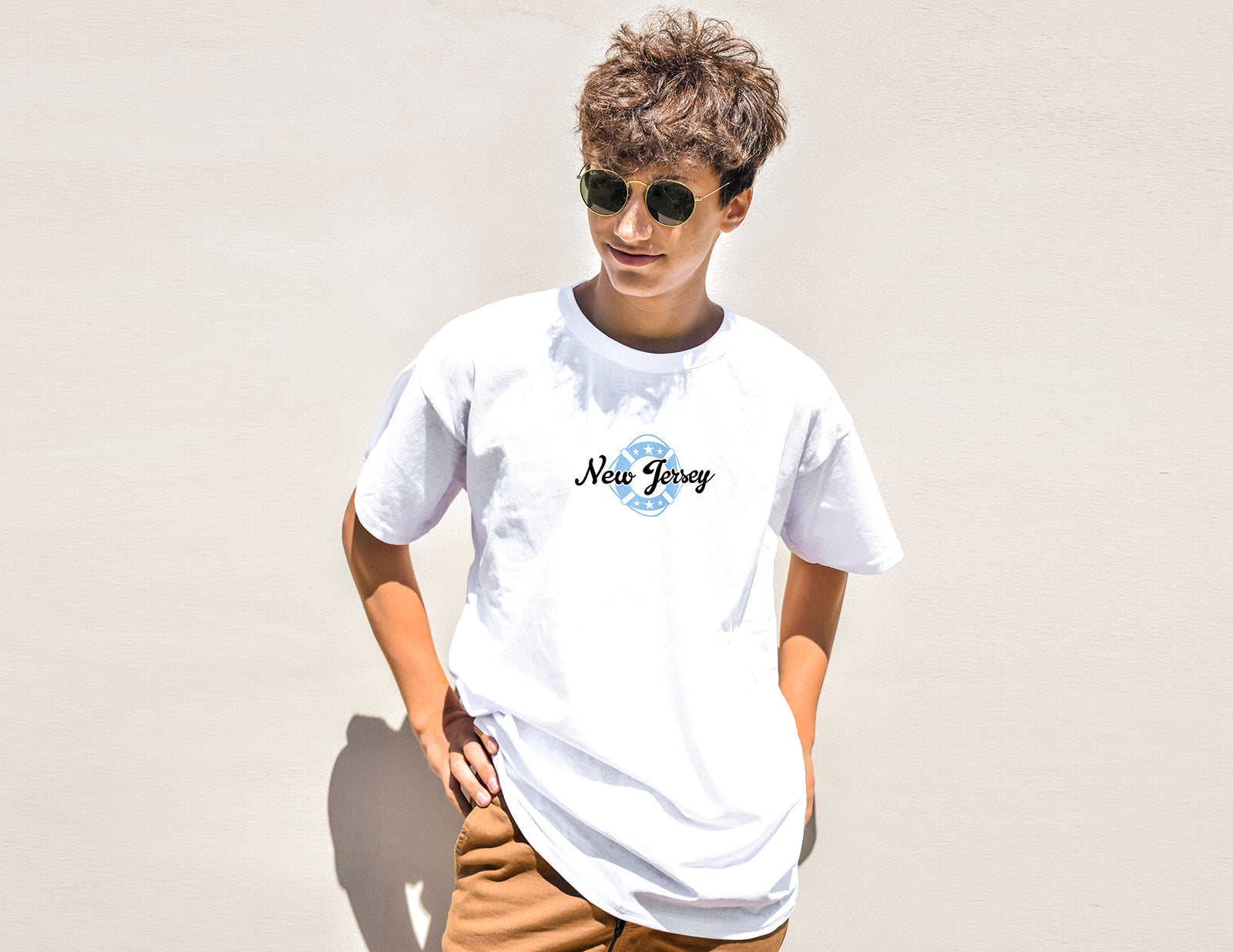 Person wearing a white t-shirt with 'New Jersey' text against a plain background