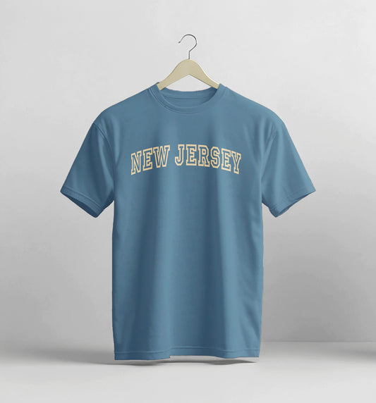 Blue t-shirt with 'New Jersey' text on a hanger against a gray background