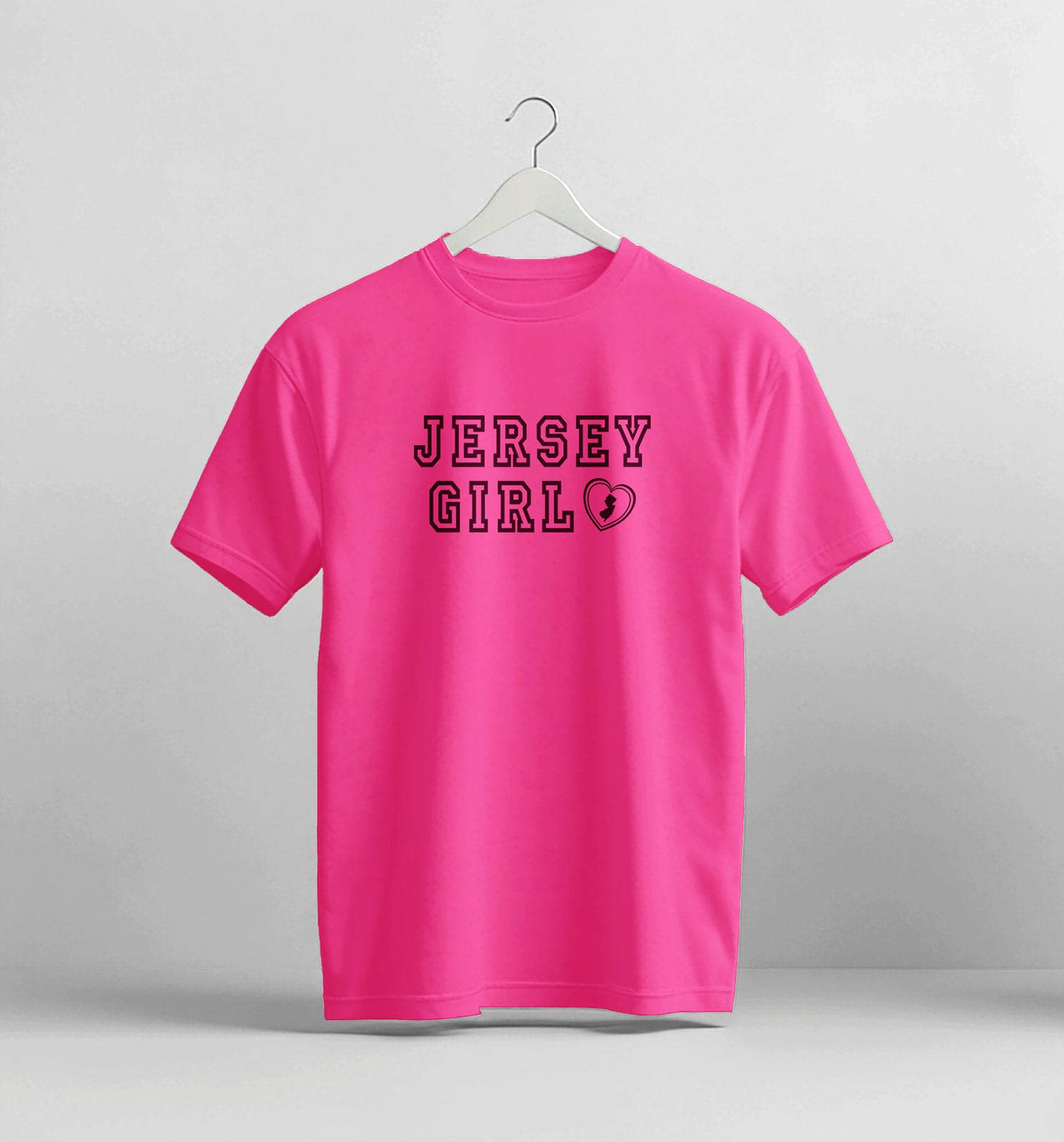 Pink t-shirt with 'Jersey Girl' text on a white background